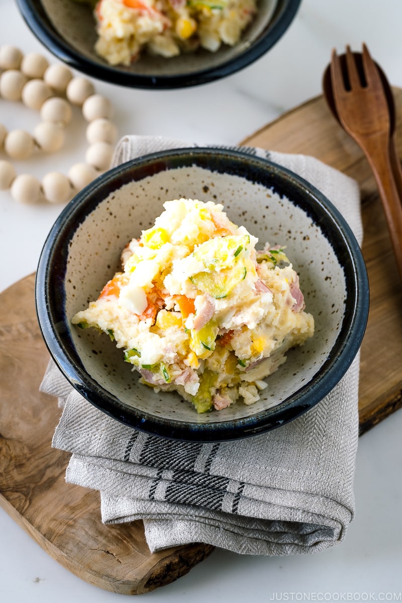 A ceramic bowl containing the Japanese potato salad.