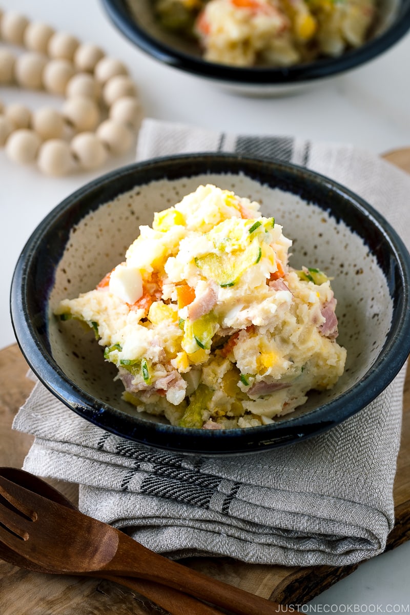 A ceramic bowl containing the Japanese potato salad.