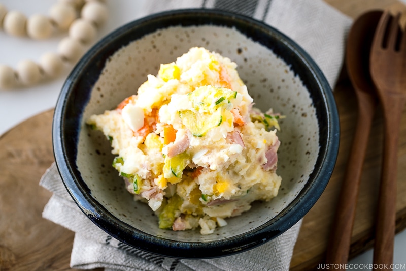 A ceramic bowl containing the Japanese potato salad.