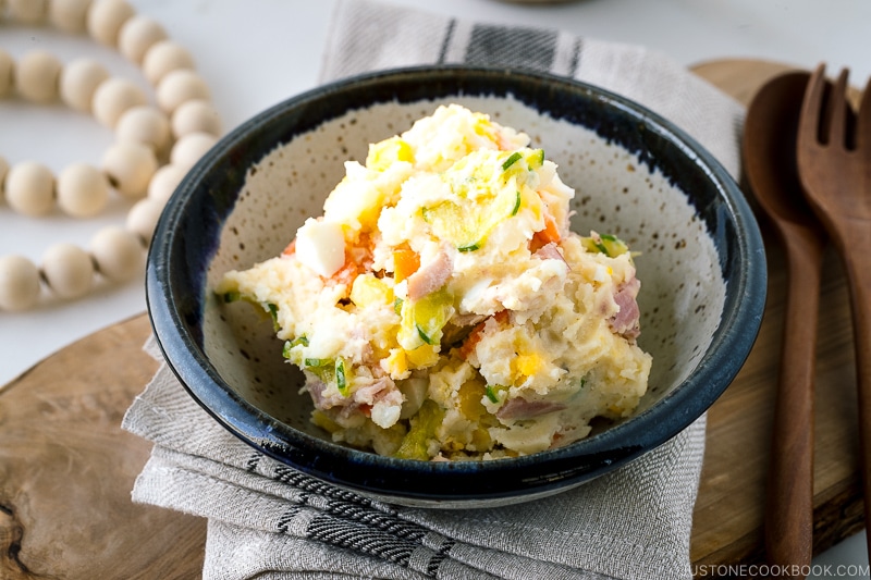 A ceramic bowl containing the Japanese potato salad.