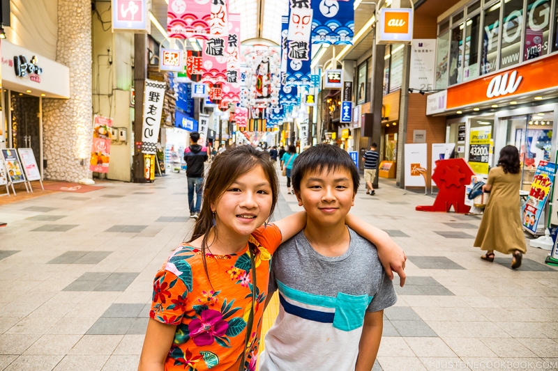 two children at Tanukikoji Shopping Street