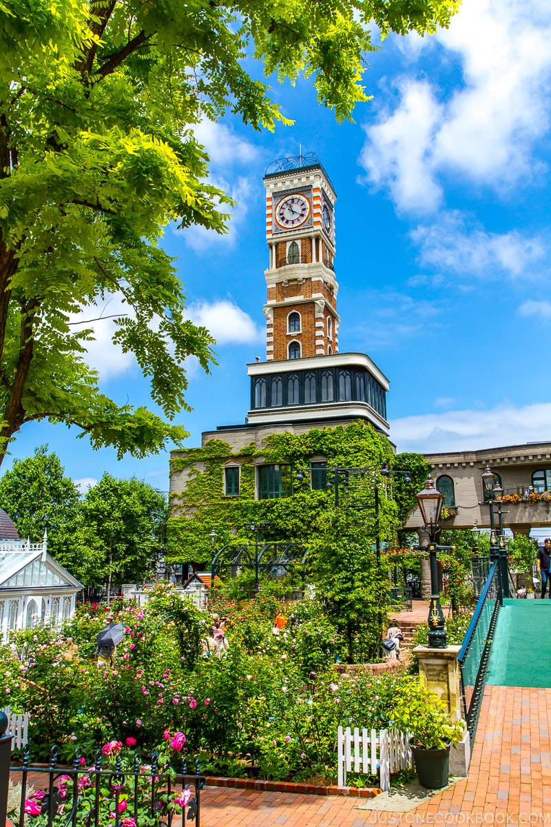 flower garden and clock tower at Ishiya Shiroikoibito Park