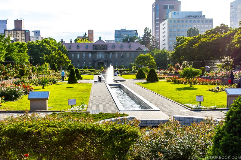 a fountain and park in front of Sapporo Archives Museum