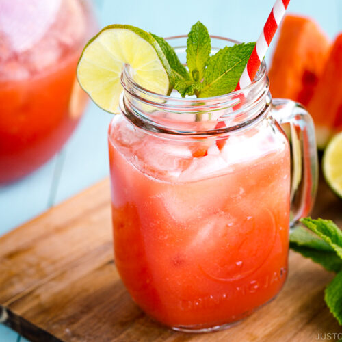 A glass jar containing homemade watermelon juice.