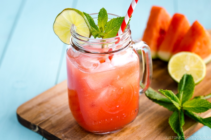 A glass jar containing homemade watermelon juice.