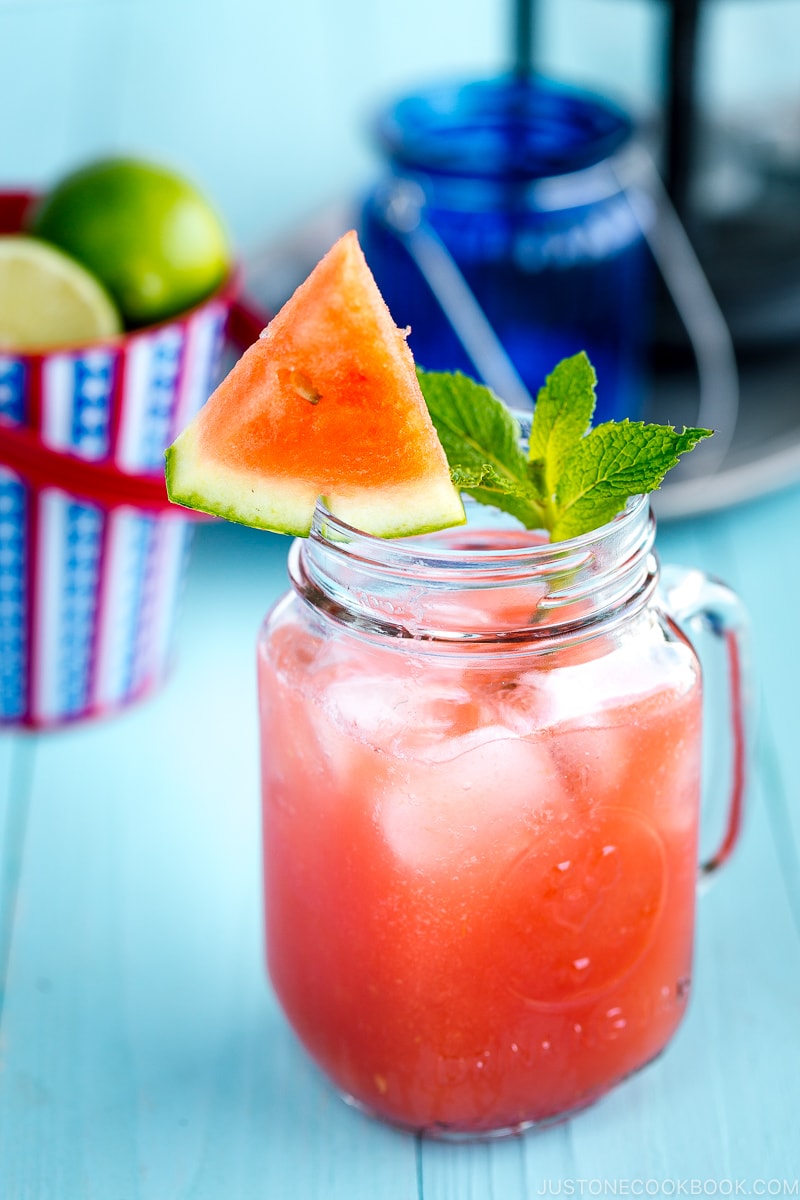 A glass jar containing homemade watermelon juice.