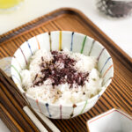 A rice bowl containing steamed rice topped with Yukari Shiso Rice Seasoning.