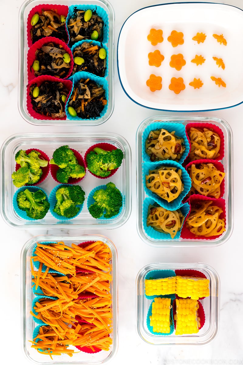 Containers filled with freezer-friendly bento dishes.