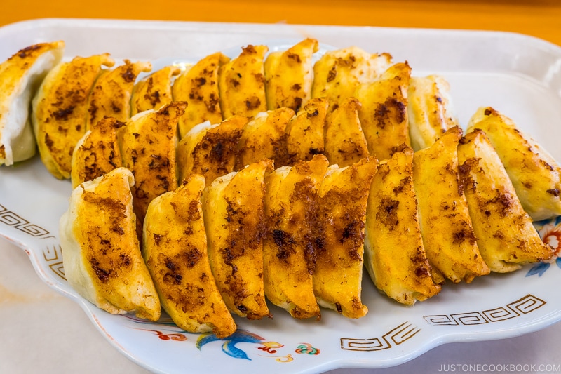 twenty five gyoza on a plate