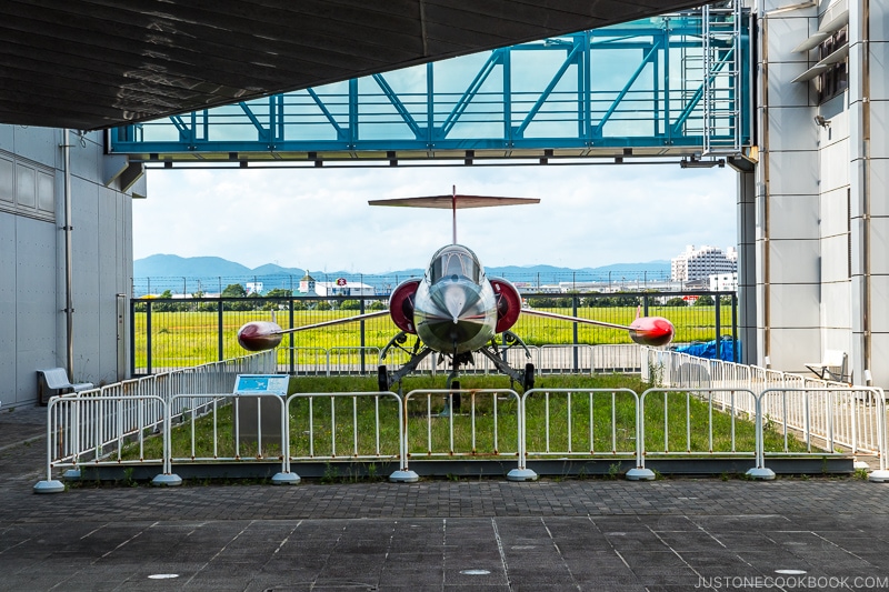 a jet within a white fence