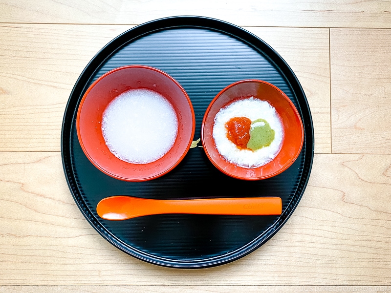A tray with two bowls of Japanese baby food for 5-6 month age.