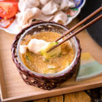 A bowl containing sesame miso sauce.