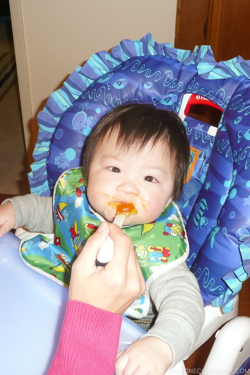 baby being fed food