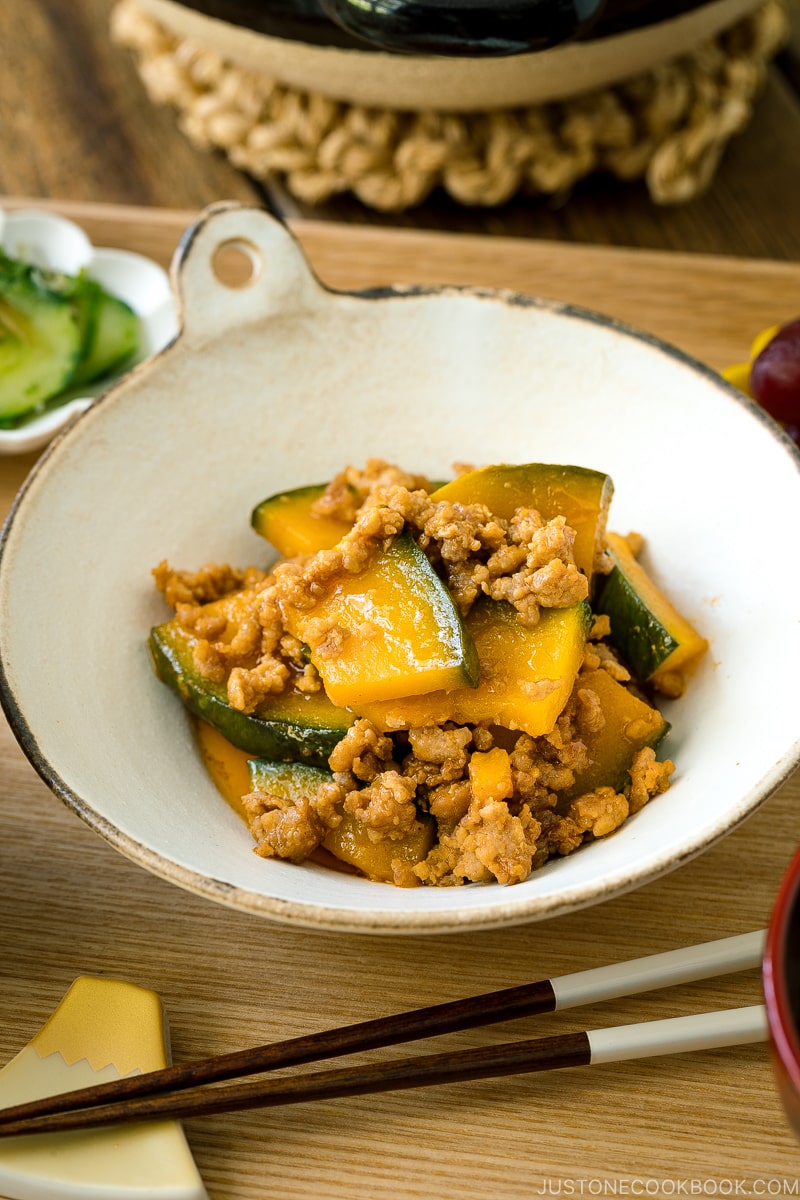 A white ceramic containing Kabocha Pork Stir Fry.