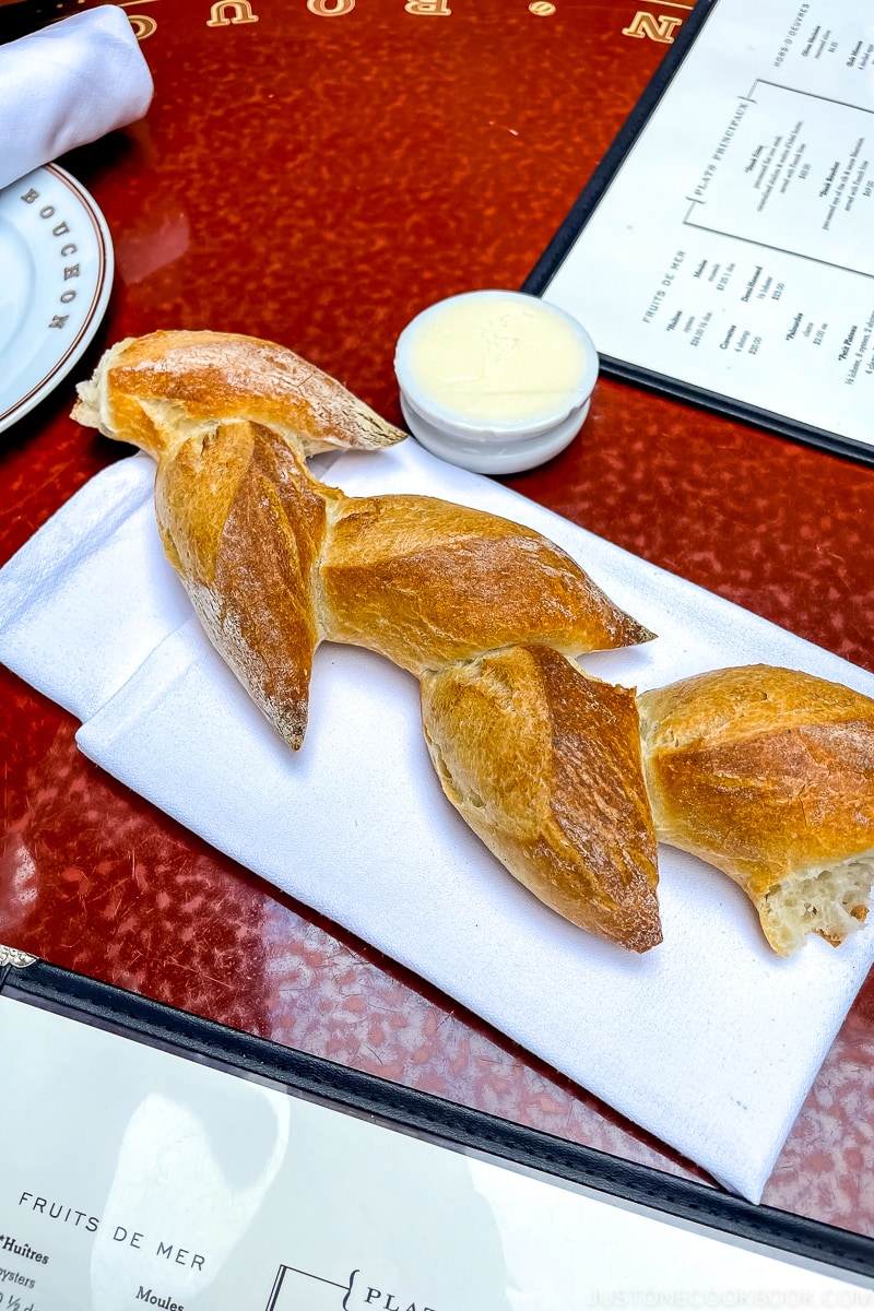 epi bread on napkin on a table
