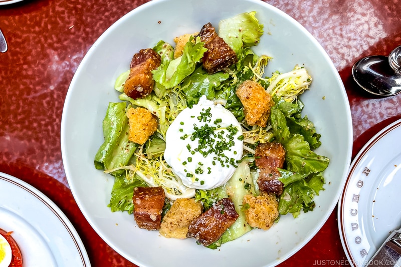 Salade Lyonnaise on a white plate