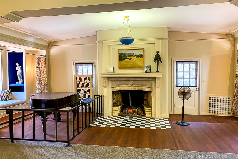 piano and fireplace inside House of Happy Walls Museum