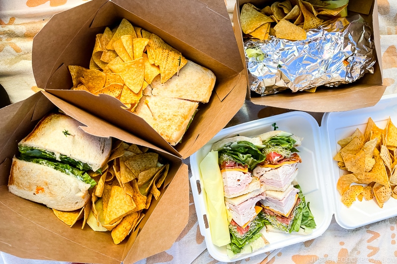 sandwiches with chips in boxes