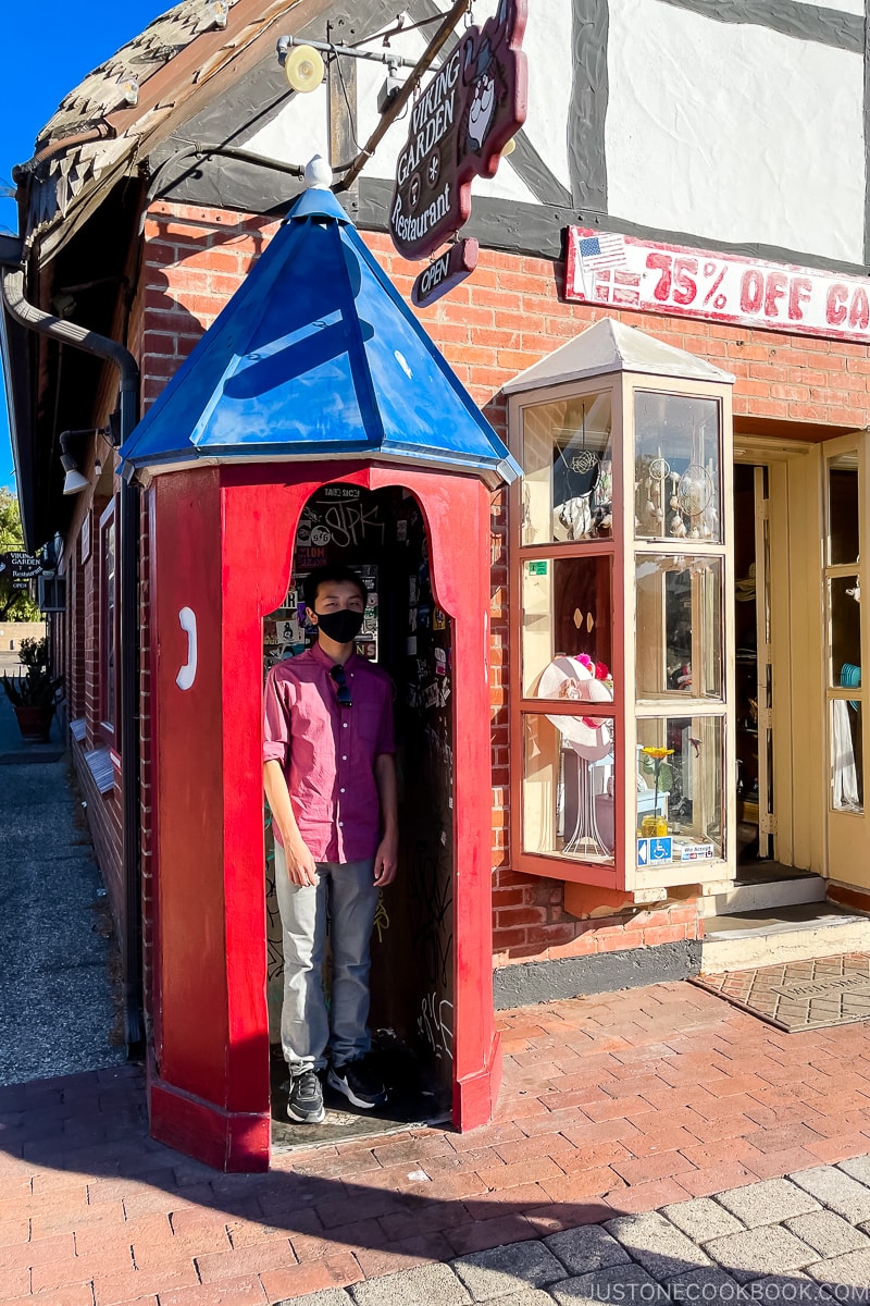 a boy inside a phone booth