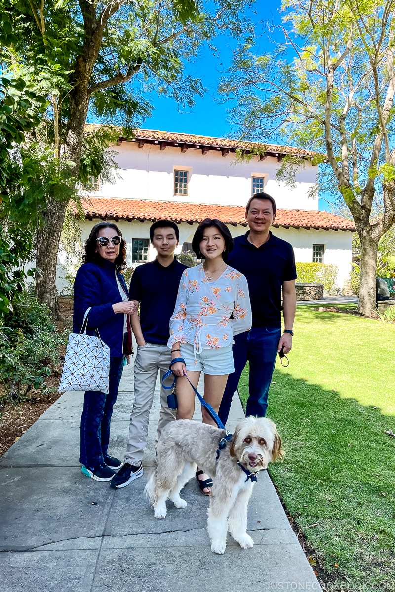 a family in front of Mission San Luis Obispo de Tolosa