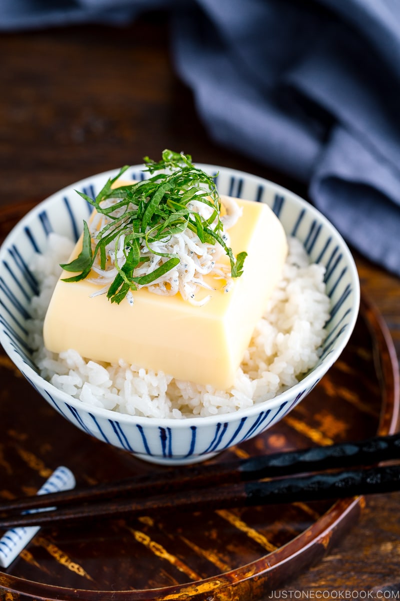 A steamed rice and egg tofu in a rice bowl.