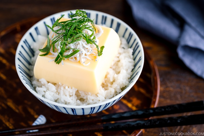 A steamed rice and egg tofu in a rice bowl.