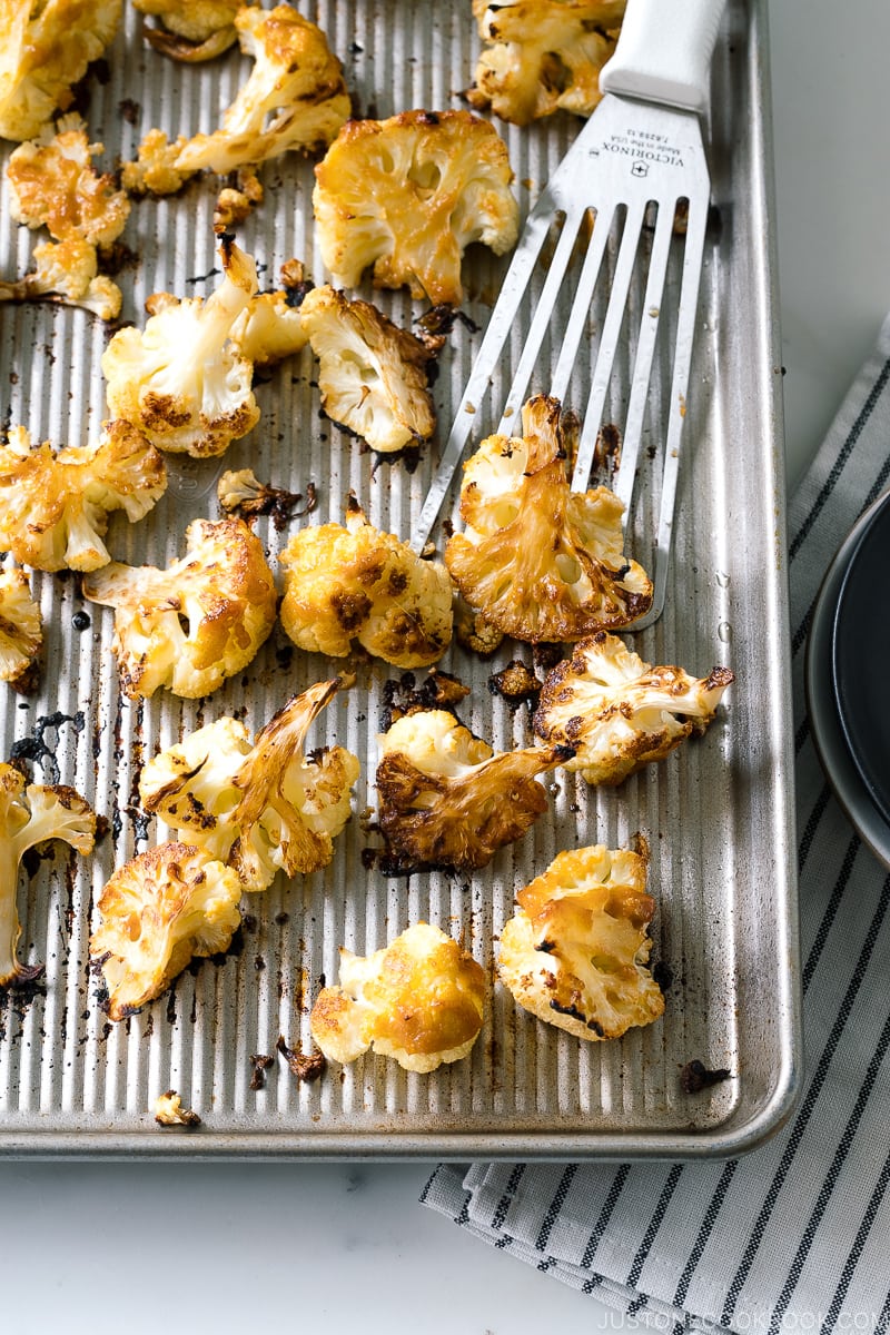 A baking sheet pan containing Roasted Miso Garlic Cauliflower.