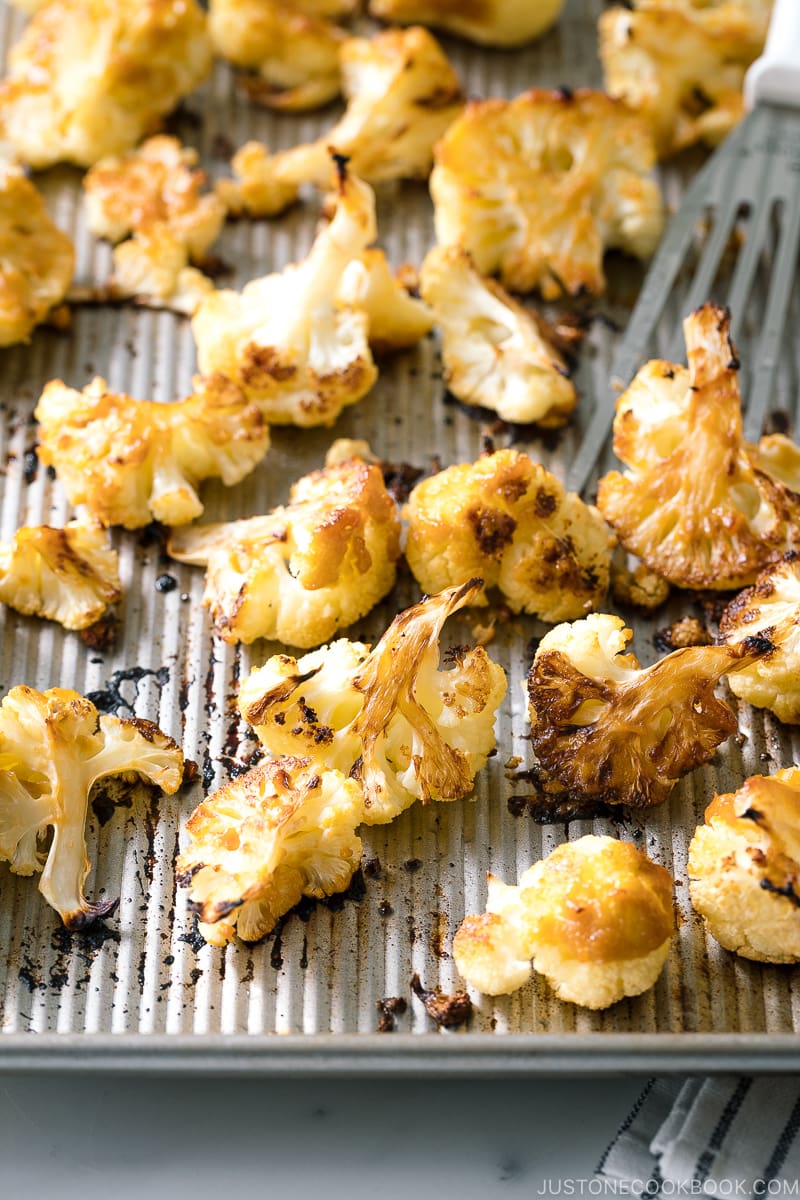 A baking sheet pan containing Roasted Miso Garlic Cauliflower.