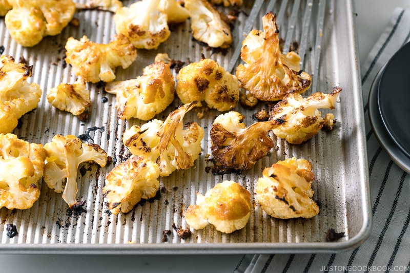 A baking sheet pan containing Roasted Miso Garlic Cauliflower.