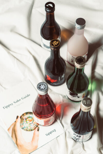 featured image of a variety of sake bottles by Tippsy Sake