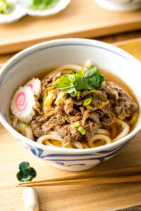 Beef udon noodle soup in a donburi bowl.
