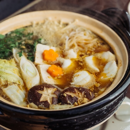 A donabe containing monkfish and vegetables.