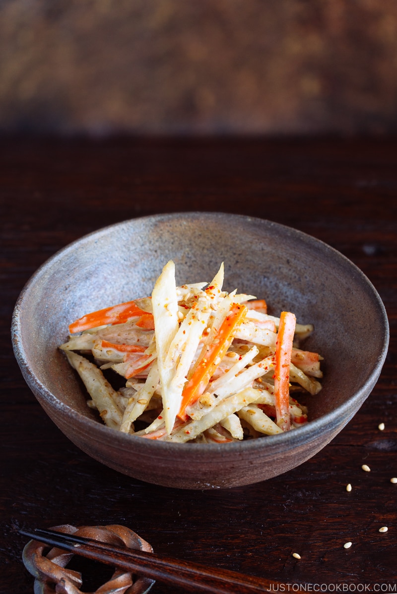 A Japanese bizen ware bowl containing Gobo Salad (Japanese Burdock Root Salad).