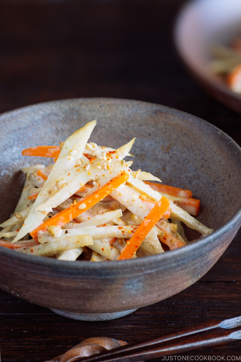 A Japanese bizen ware bowl containing Gobo Salad (Japanese Burdock Root Salad).