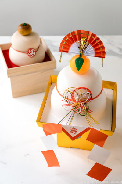 Kagami Mochi decorations: one made with plastic and the other made with hinoki wood.