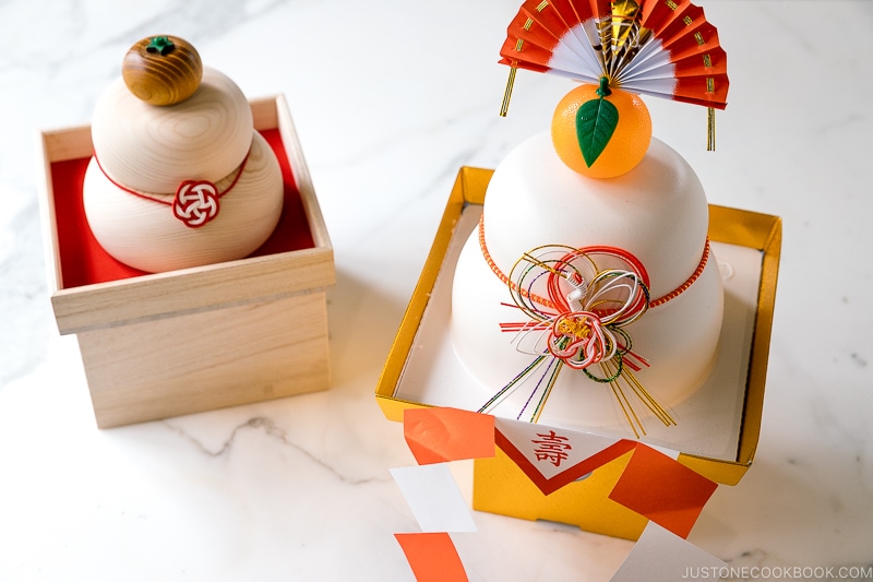 Kagami Mochi decorations: one made with plastic and the other made with hinoki wood.
