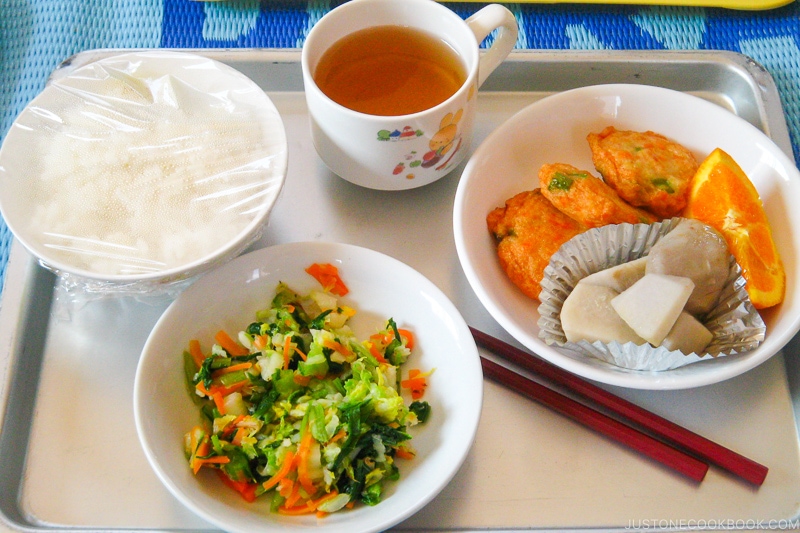 Japanese school lunch with rice, main dish, and side dish