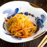 A Japanese ceramic bowl containing Simmered Kiriboshi Daikon.