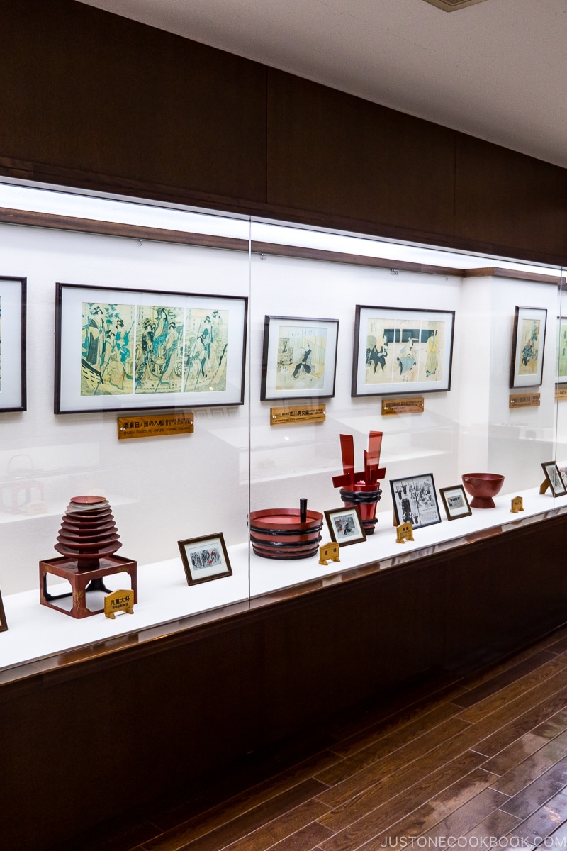 sake making equipment behind display case