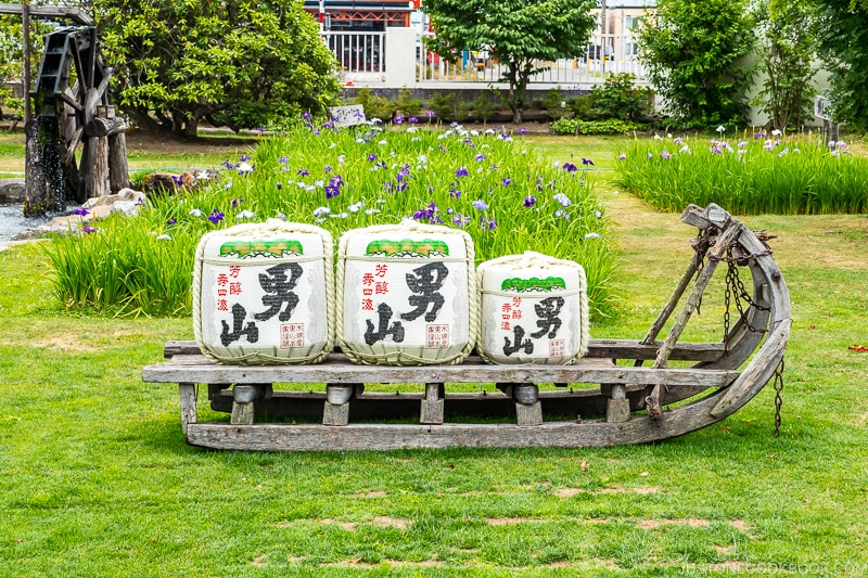 3 sake barrels on a wood sled