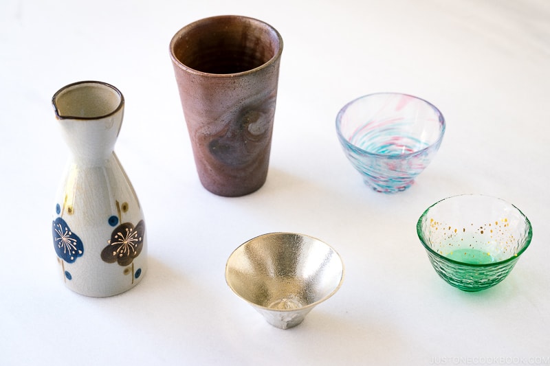 various sake vessel and cups on a marble table