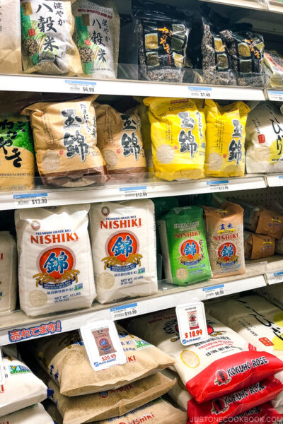 A Japanese grocery store showing the rice shelf.