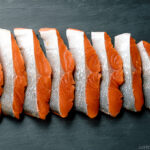 Step by step instructions on how to cut half a salmon into thin Japanese-style fillets.