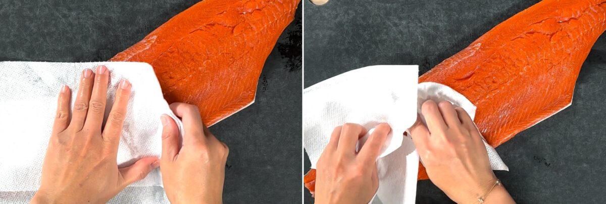 Two images side by side show hands patting a raw salmon fillet dry on a dark surface, an essential first step in how to cut salmon into Javanese style fillets. The left image shows the left side; the right image shows the right side.