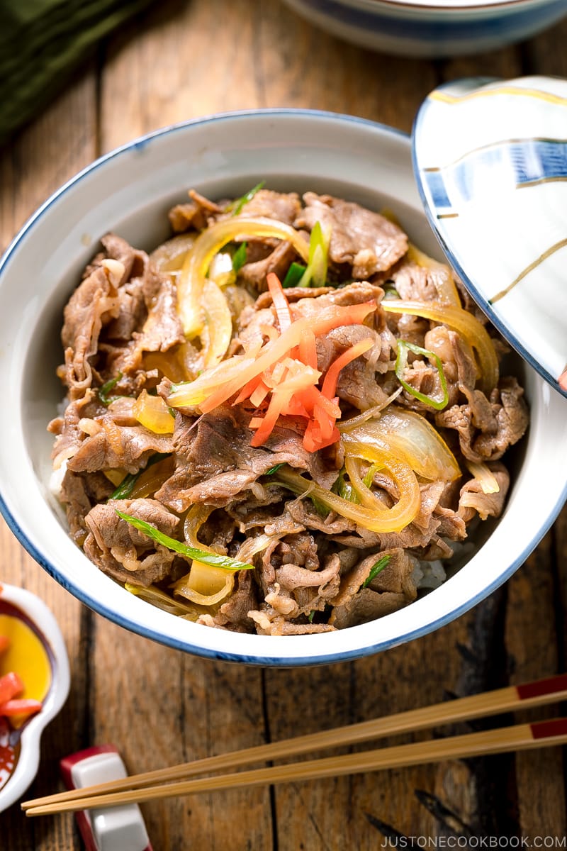 A donburi rice bowl containing gyudon, simmered beef and onions over steamed rice.