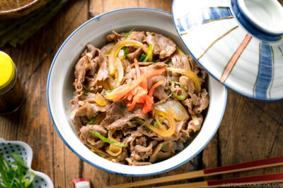 A donburi rice bowl containing gyudon, simmered beef and onions over steamed rice.