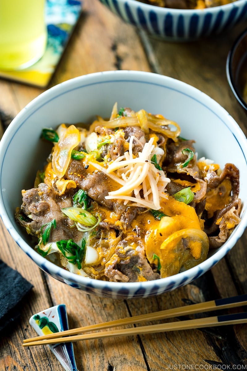 A Japanese donburi bowl containing Tanindon, which is simmered beef and egg over steamed rice.