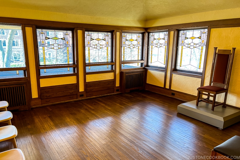 a room with stained glass window inside Frederick C. Robie House