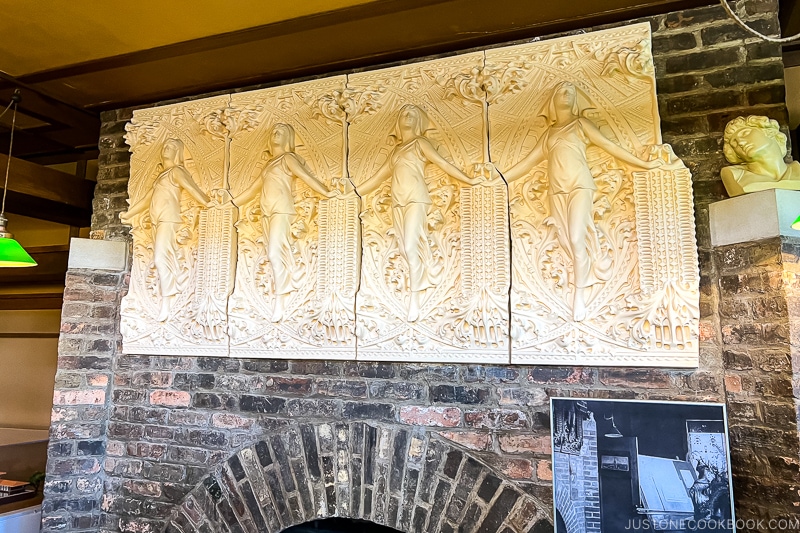 plaster decoration on top of fireplace