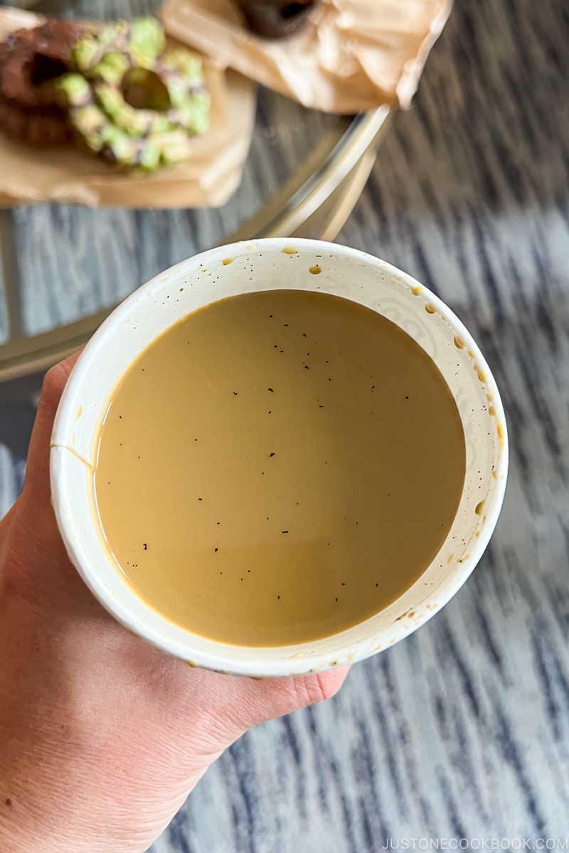 looking at coffee inside a paper cup